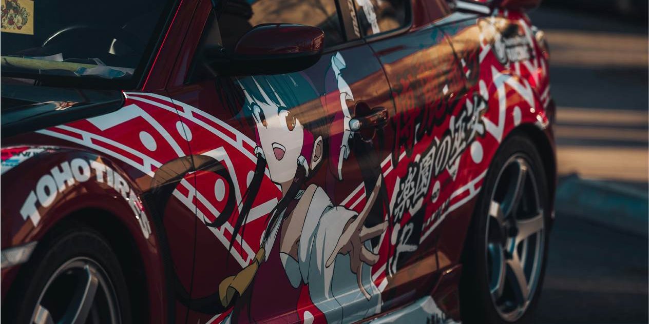 Close up of anime car wrap design at a car show