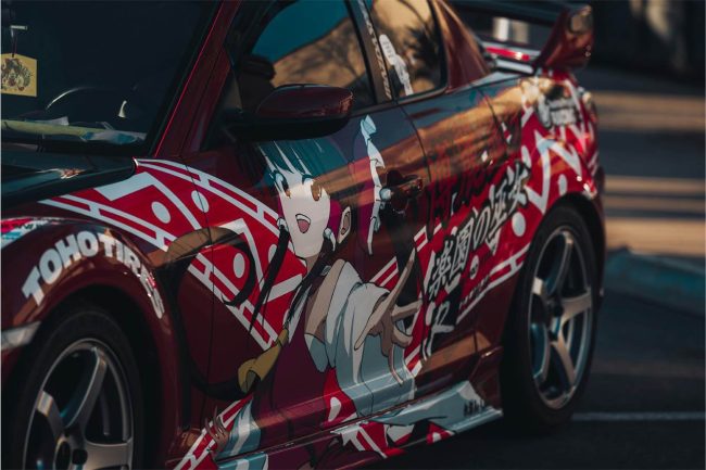 car-show-design-what-a-designer-notices Close up of anime car wrap design at a car show
