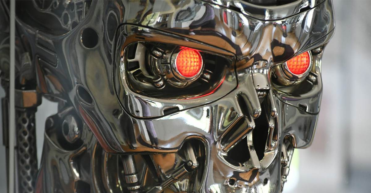 Terminator skull with glowing red eyes representing fears around AI replacing humans