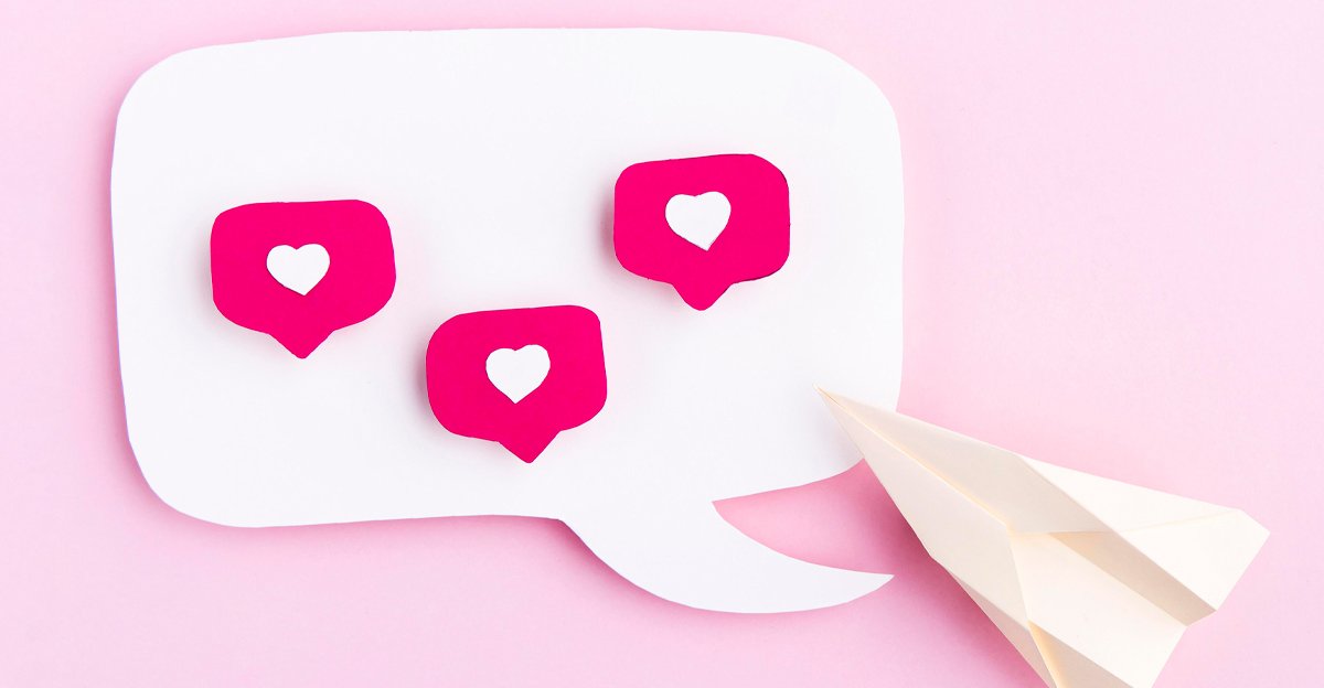 A pink speech bubble with heart icons and a paper plane — two stars and a wish feedback method when you brief a designer
